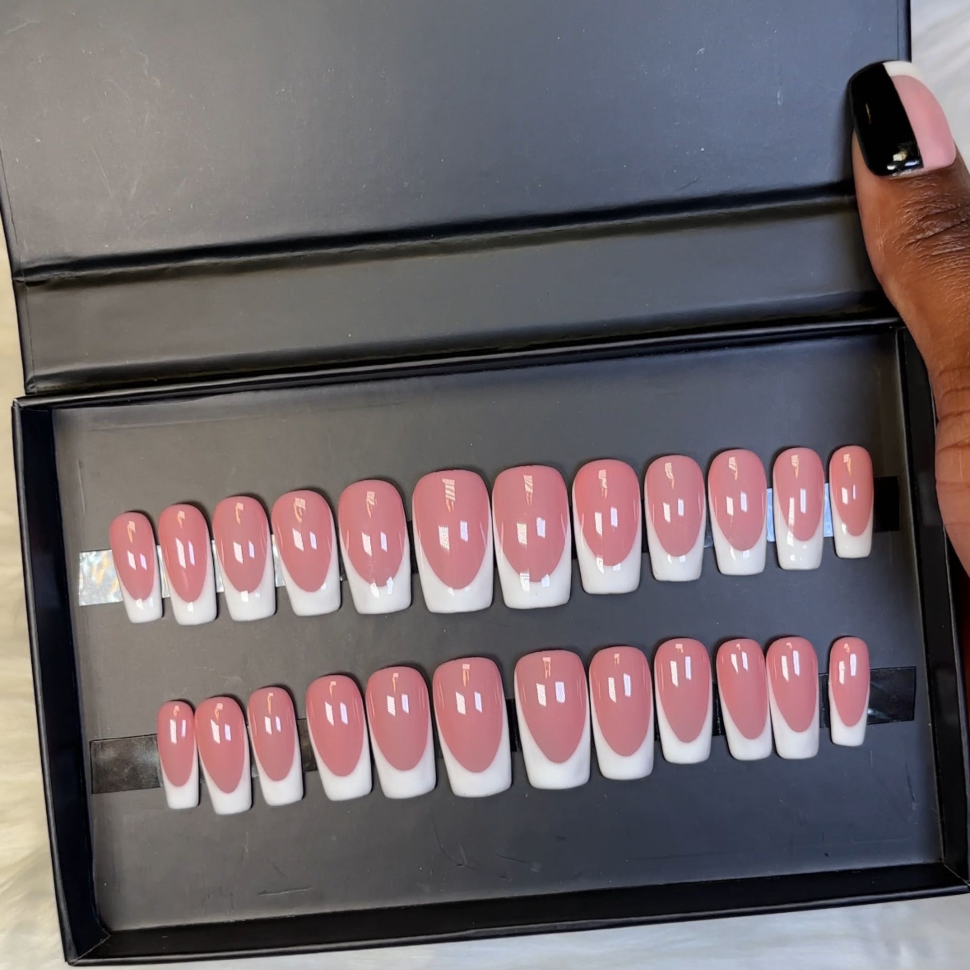 Modern French Tip Press-On Nails with a crisp, high-gloss finish. Hand-painted on 100% Gel X tips for a salon-quality, reusable look. Available in Square shape