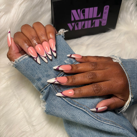 stiletto White French tip press-on nails featuring pink isolated chrome abstract accents. A modern twist on the classic French manicure with a sleek, high-gloss finish. Hand-painted on 100% Gel X tips for a salon-quality, reusable finish.