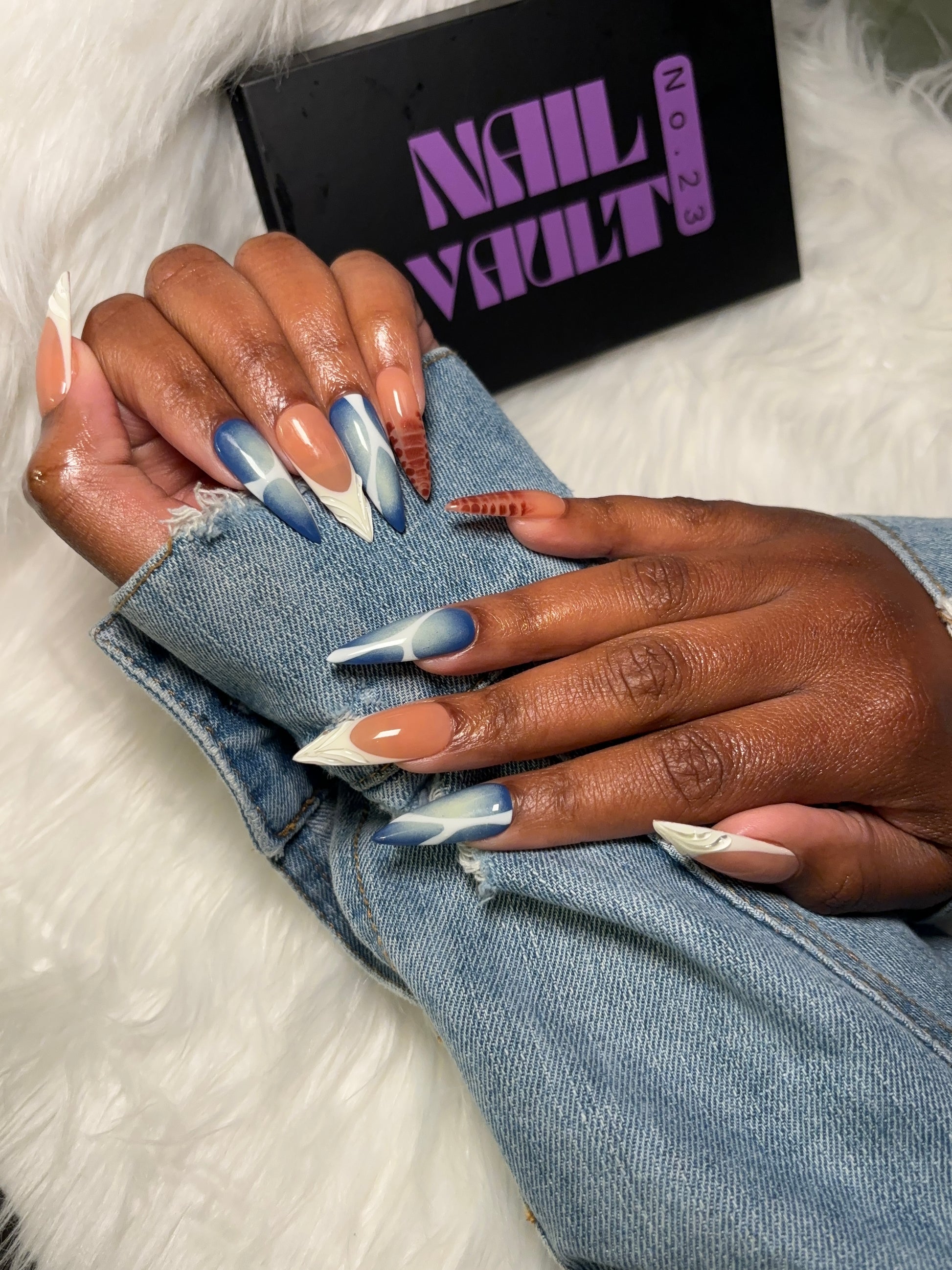 Multi-design press-on nail set featuring brown blooming gel, blue & white aura airbrush with abstract accents, and classic white French tips with 3D jelly details. Each nail is hand-painted on 100% Gel X tips for a salon-quality, reusable finish. Available in Square, Stiletto, Ballerina, and Coffin shapes