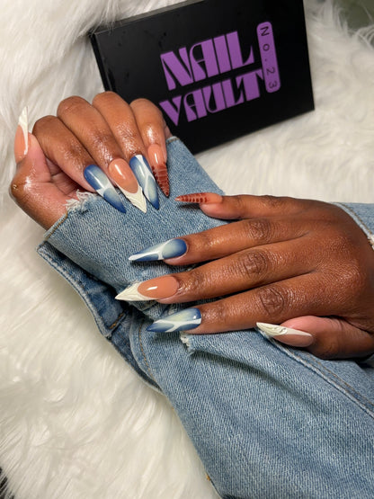 Multi-design press-on nail set featuring brown blooming gel, blue & white aura airbrush with abstract accents, and classic white French tips with 3D jelly details. Each nail is hand-painted on 100% Gel X tips for a salon-quality, reusable finish. Available in Square, Stiletto, Ballerina, and Coffin shapes