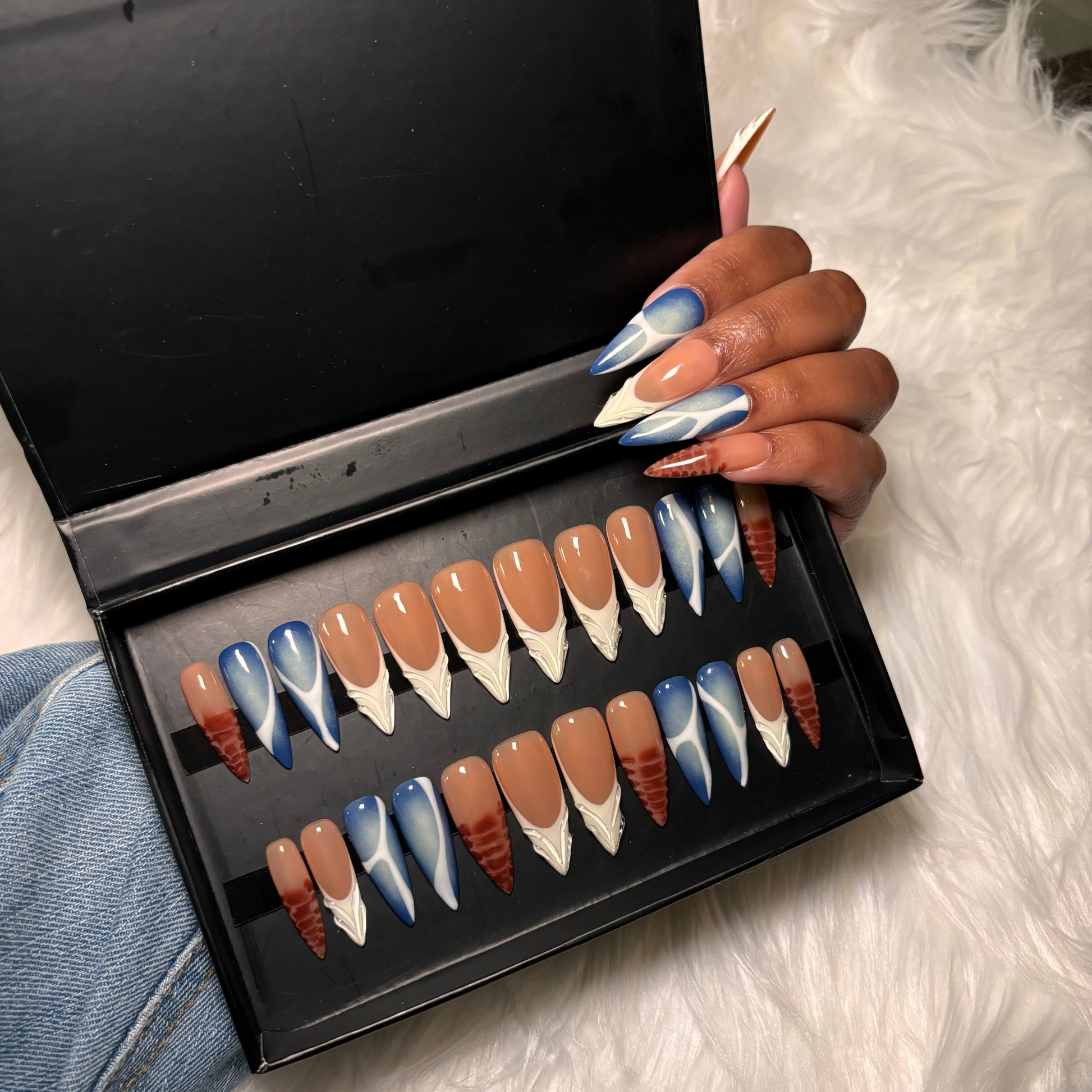 Multi-design press-on nail set featuring brown blooming gel, blue aura airbrush, white aura airbrush, abstract nail, classic white French tips, Makartt 3D jelly details Stiletto shape ,Gel X Press on naisls