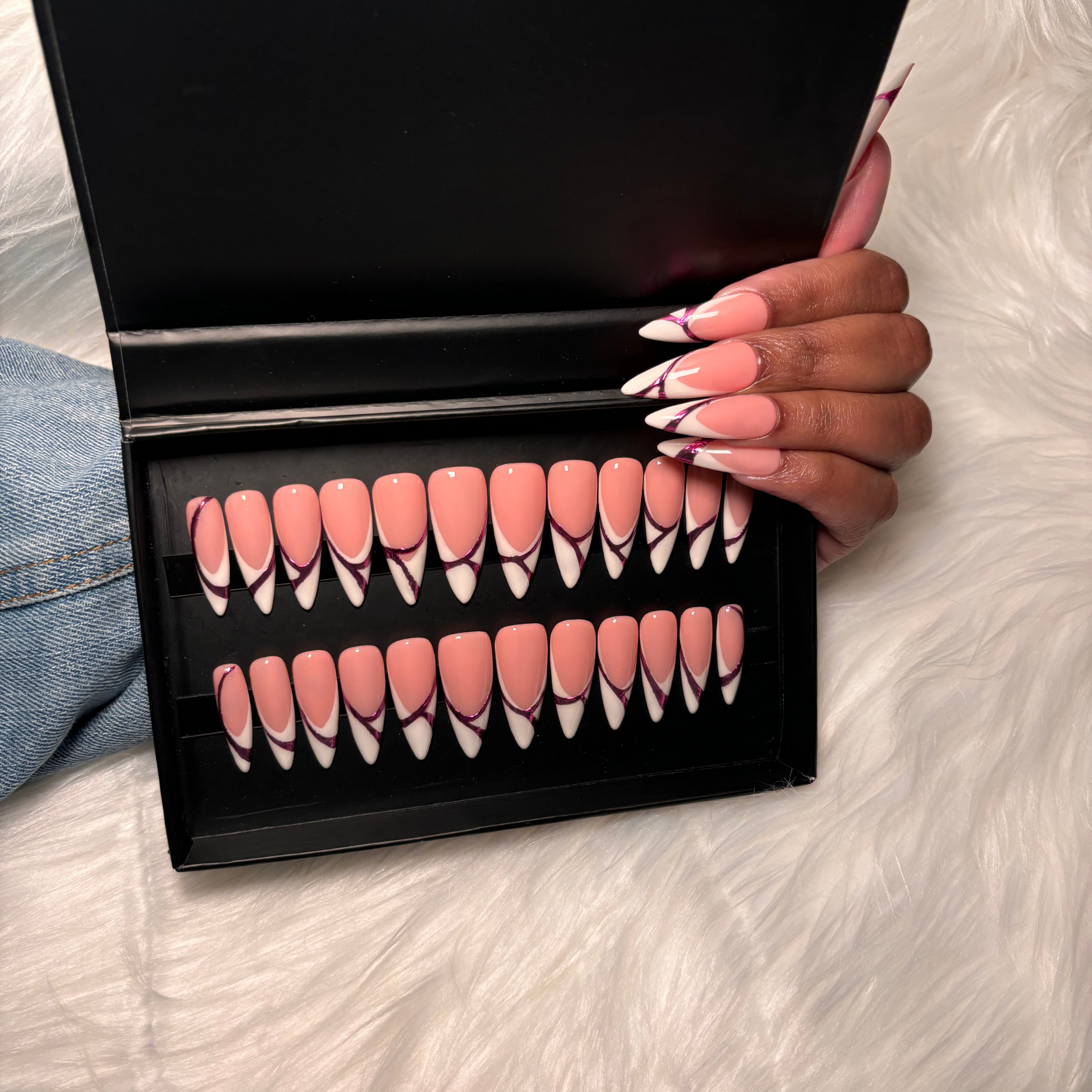 White French tip press-on nails featuring pink isolated chrome abstract accents. A modern twist on the classic French manicure with a sleek, high-gloss finish. Hand-painted on 100% Gel X tips for a salon-quality, reusable finish. Available in Square, Stiletto, Ballerina, and Coffin shapes